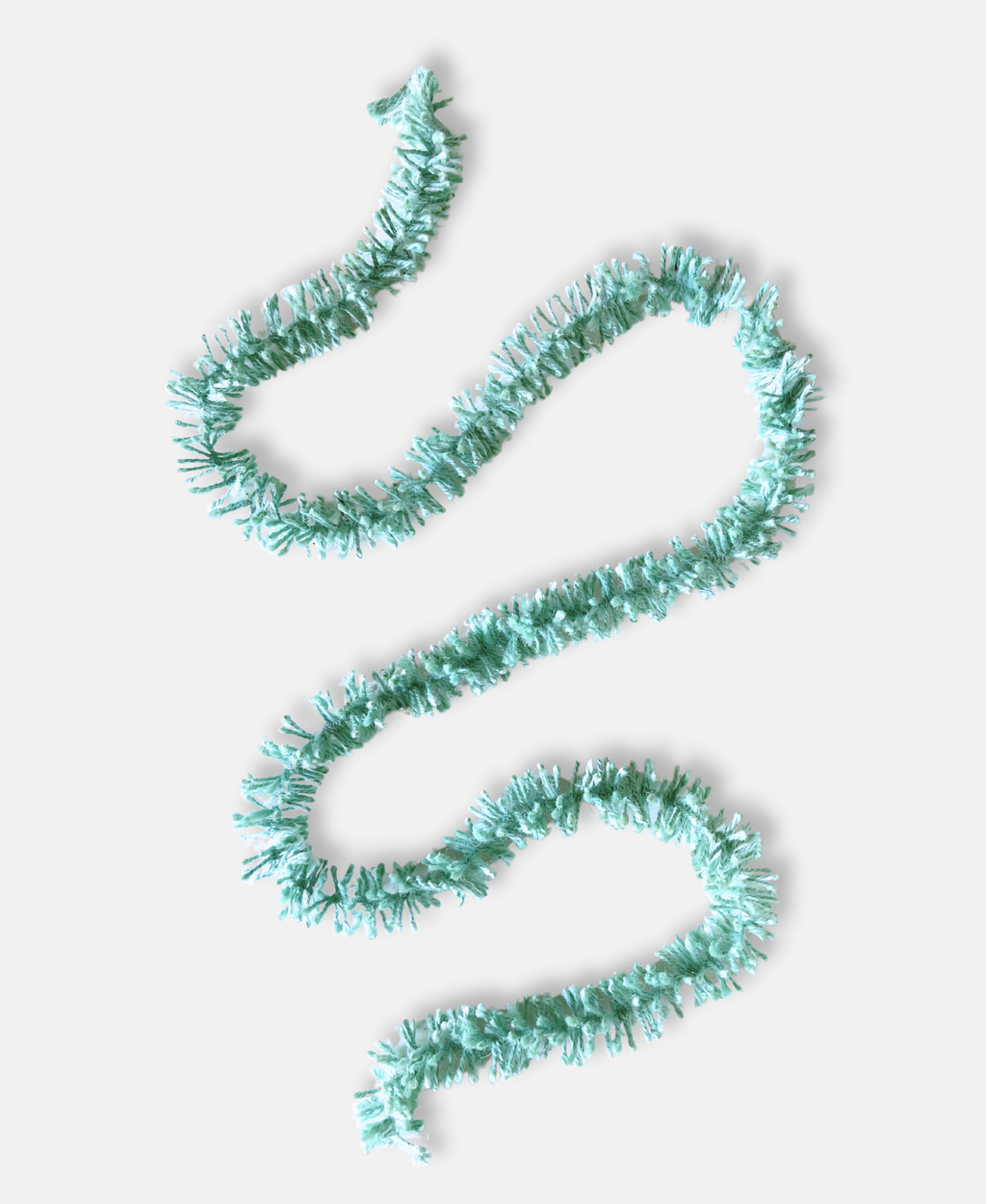 Duck Egg blue Strinsel jute string tinsel  on a pale grey background