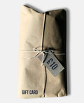 Package wrapped in brown paper and string with a £10 tag on a white background