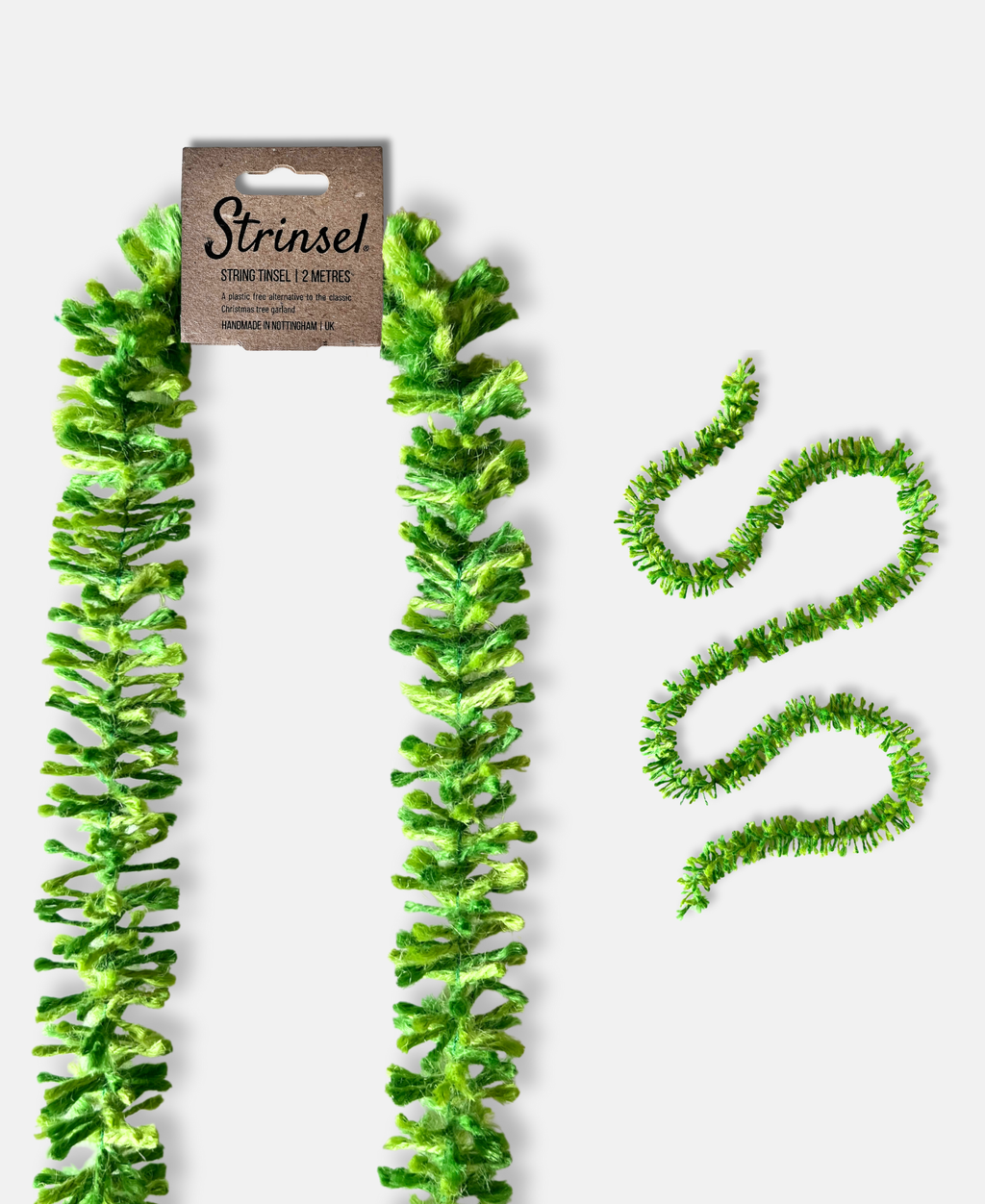 Green pop Strinsel jute string tinsel with and without packaging on a pale grey background