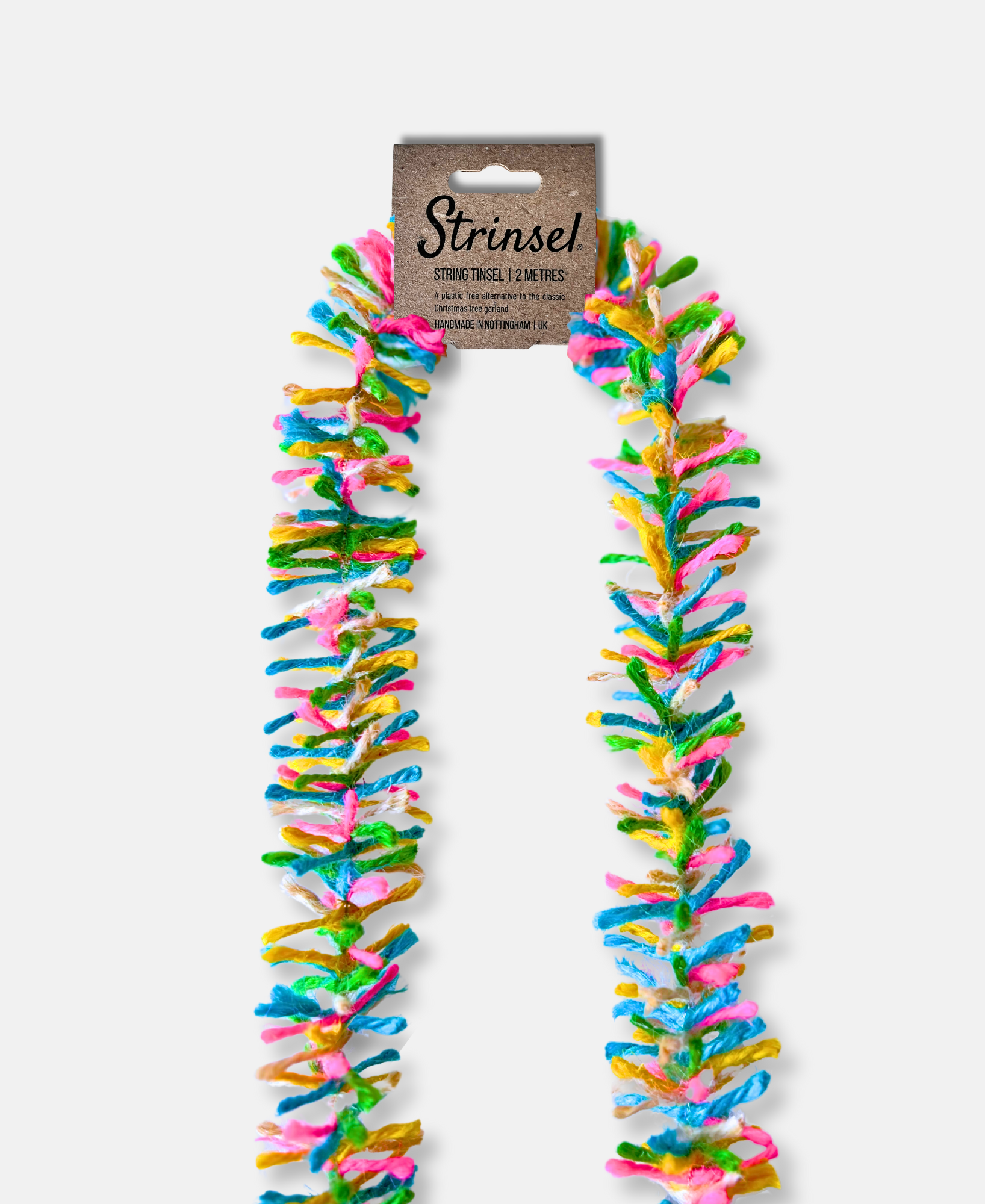 Neon Pop Strinsel jute string tinsel with packaging on a pale grey background