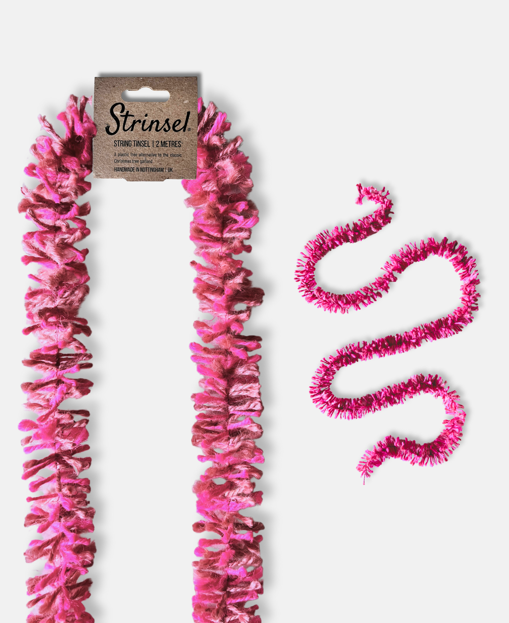 Pink Pop Strinsel jute string tinsel with and without packaging on a pale grey background