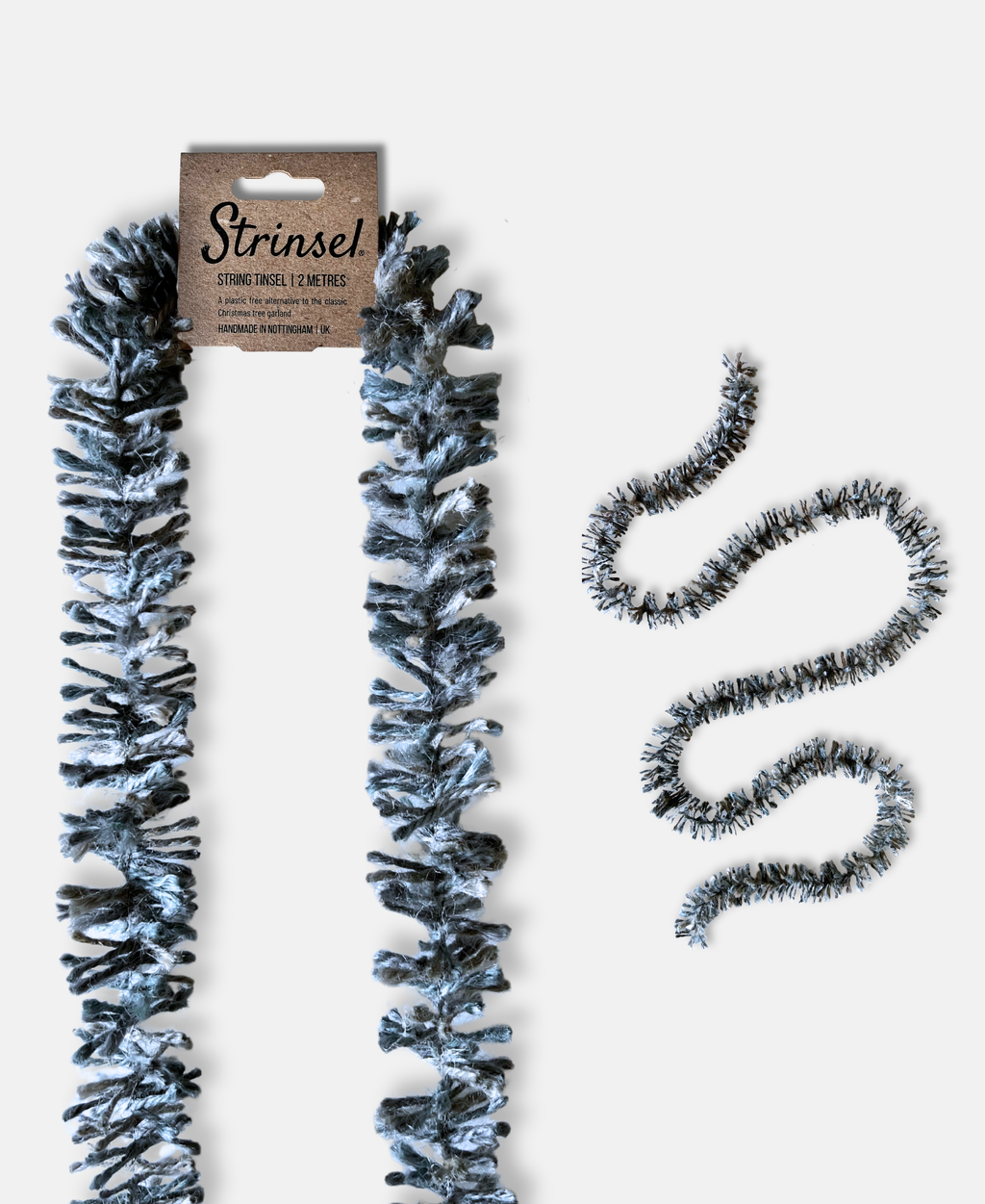 Silvery Pewter Strinsel jute string tinsel with and without packaging on a pale grey background