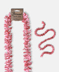 Soft pink Strinsel jute string tinsel with and without packaging on a pale grey background