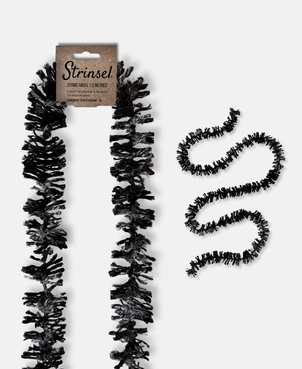 Black Jute spider leg Strinsel string tinsel garland with kraft label laid out flat on a white background with a smaller image of a length of Strinsel winding on a white background