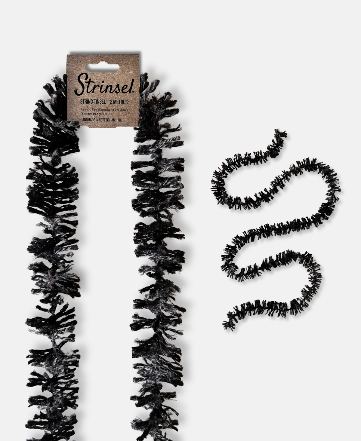 Black Jute spider leg Strinsel string tinsel garland with kraft label laid out flat on a white background with a smaller image of a length of Strinsel winding on a white background