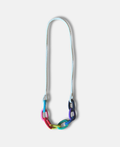 Rainbow themed chunky "string bling" necklace with white chain on a pale grey background